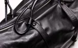 black leather messenger bag